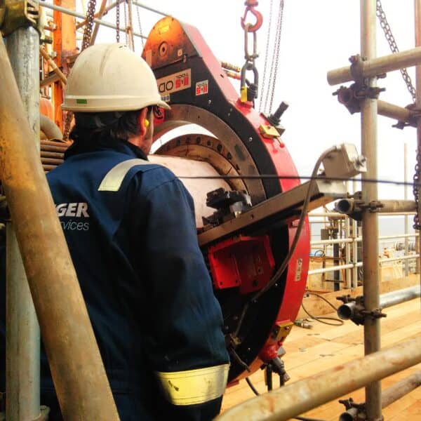KLINGER Integrity Services field employee working on machining equipment